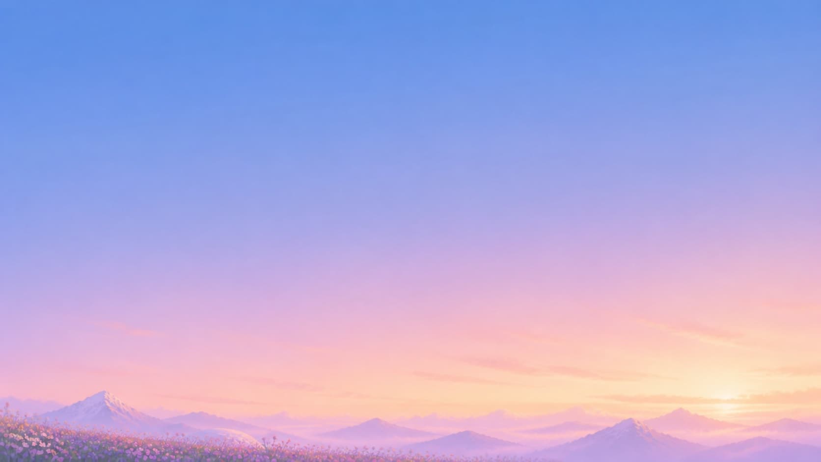 A soft dawn sky above distant mountains and a low meadow of wildflowers